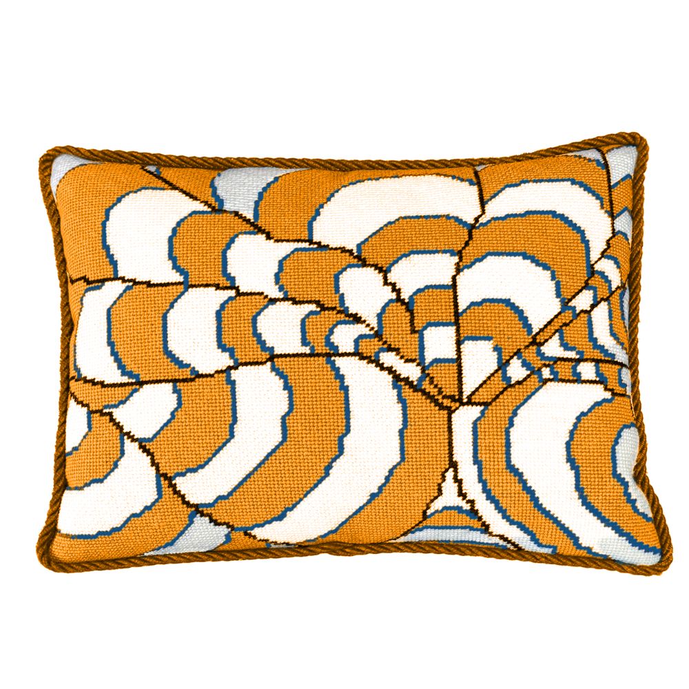 Decorative needlepoint pillow with orange and white abstract pattern on a white background