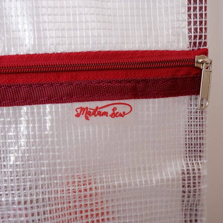 White mesh bag with a red zipper