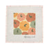 A square needlepoint canvas featuring a central design of stylized pumpkins in orange, peach, and green on a cream background, surrounded by a light pink stitched border with small floral accents and the brand name &