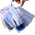 Clear plastic bag with blue thread and a keychain, labeled &