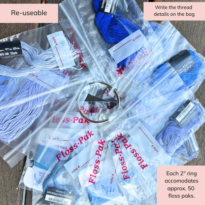 Collection of Floss-Pak packages with blue and white floss, labeled &