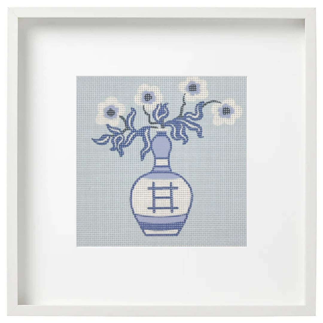 Needlepoint canvas design of a blue vase with flowers on a light blue background, framed in white | 5" x 5"| 18 count canvas