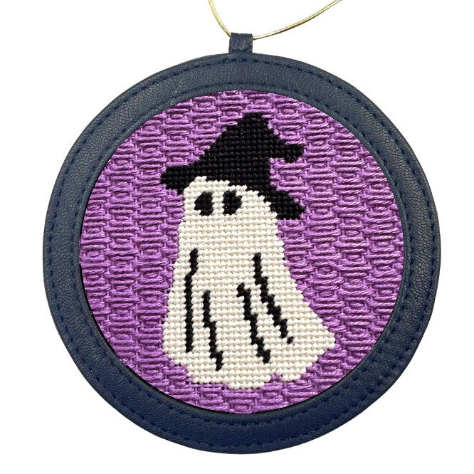 A halloween needlepoint ornament of a ghost dressed up as a witch