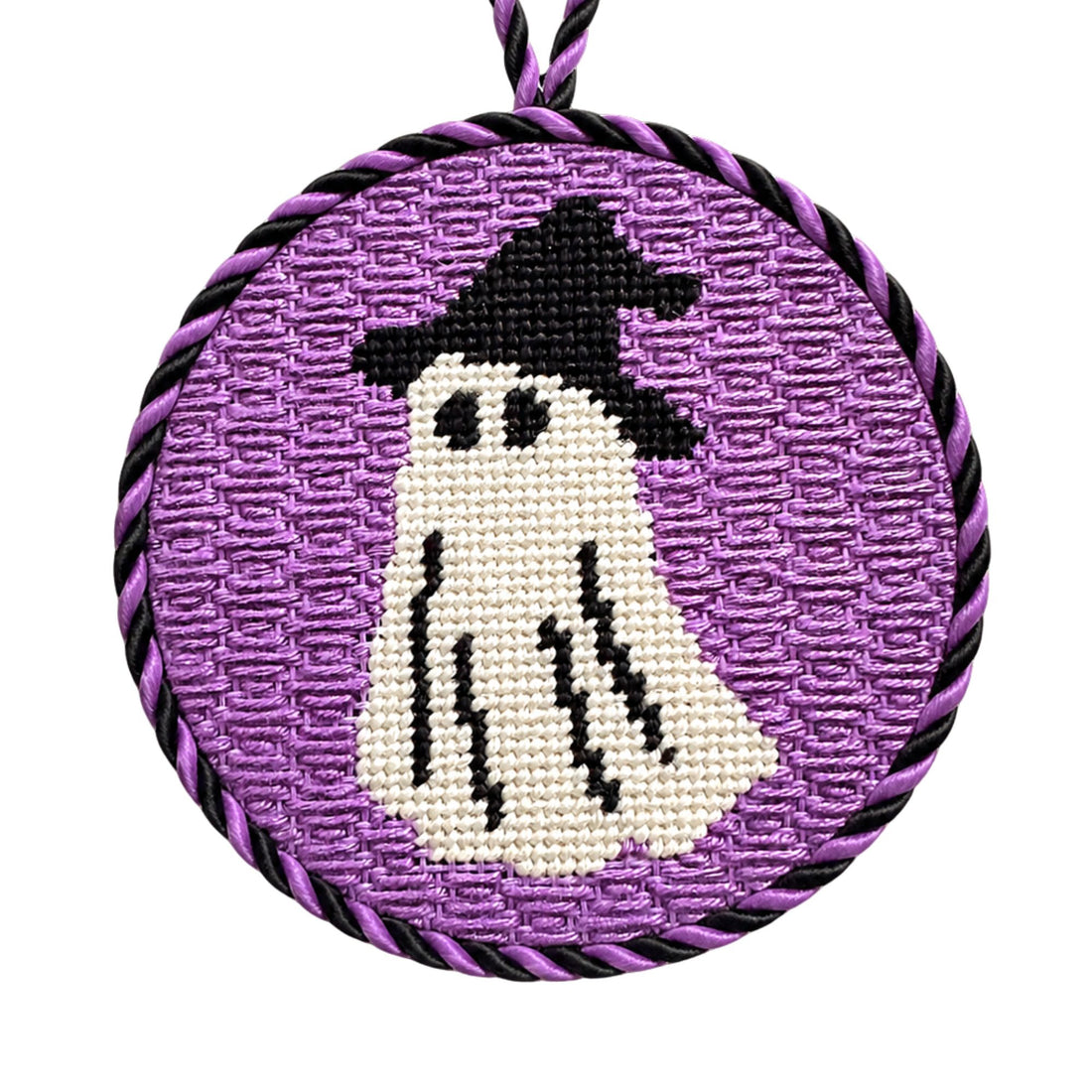 A halloween needlepoint ornamentof a ghost dressed up as a witch