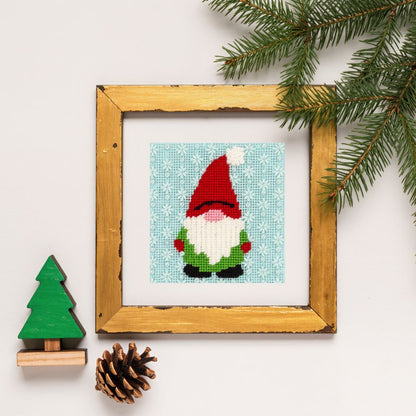 gnome needlepoint design in a gold frame