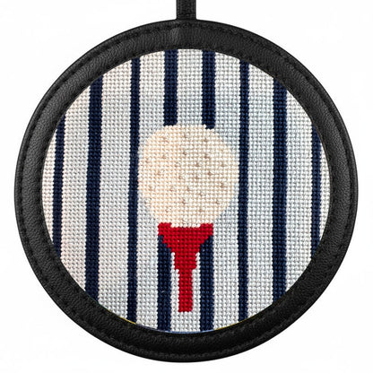 gold ball on a tee needlepoint ornament in a black frame