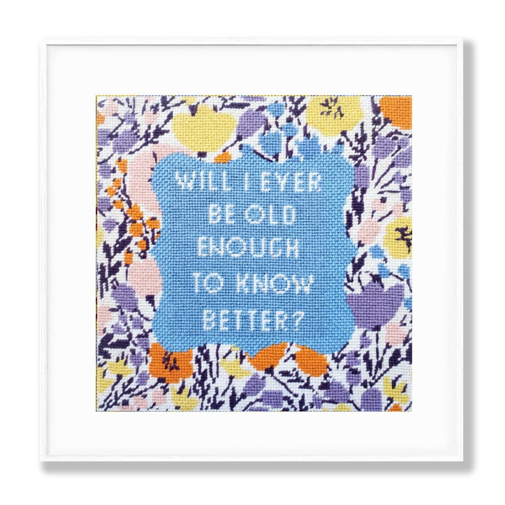 Framed needlepoint print with floral border and text &