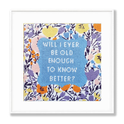 Framed needlepoint print with floral border and text &