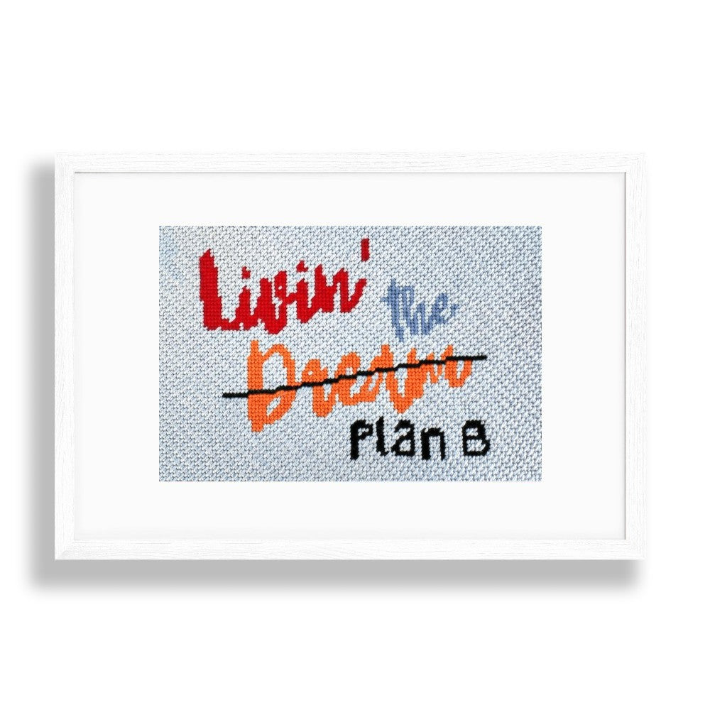 Livin the Dream needlepoint design in a white frame
