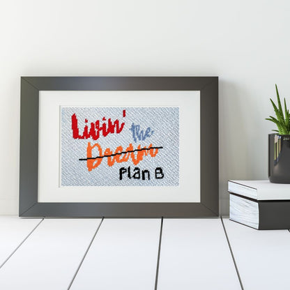 Livin the dream needlepoint in a black frame