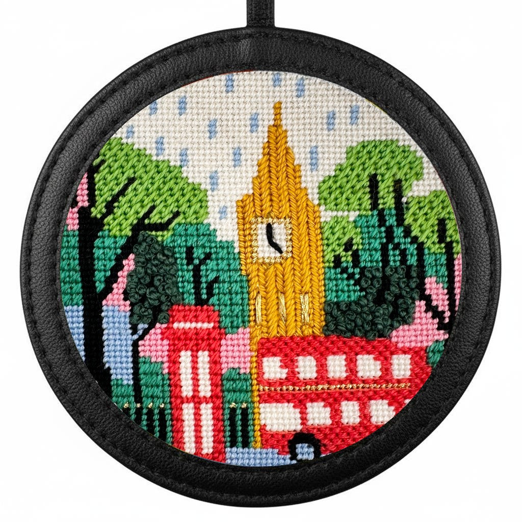 London needlepoint design in a black leather frame