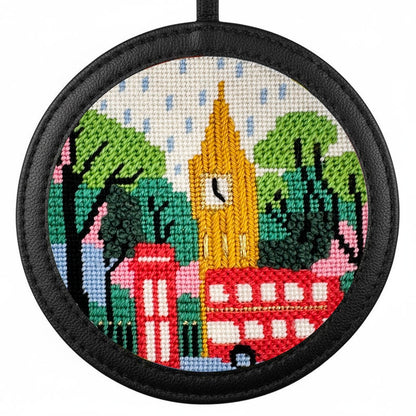 London needlepoint design in a black leather frame
