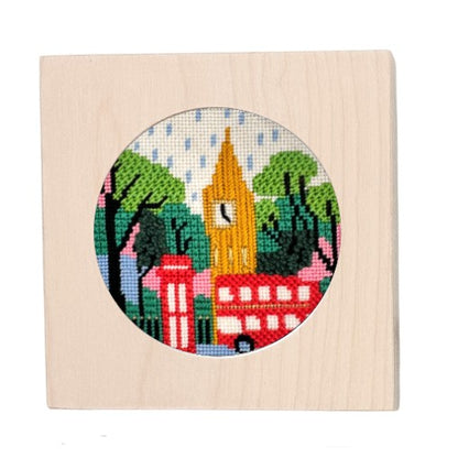 London needlepoint kit in a white-washed wooden frame