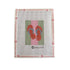 Needlepoint canvas with a design of red flip-flops on a pink background, framed by Poppy Murnen&