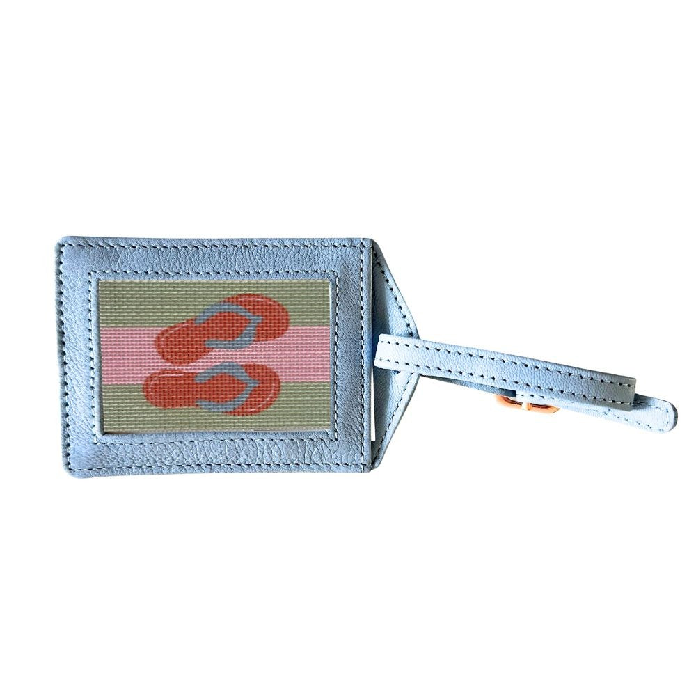 Luggage tag with flip-flop design on a white background