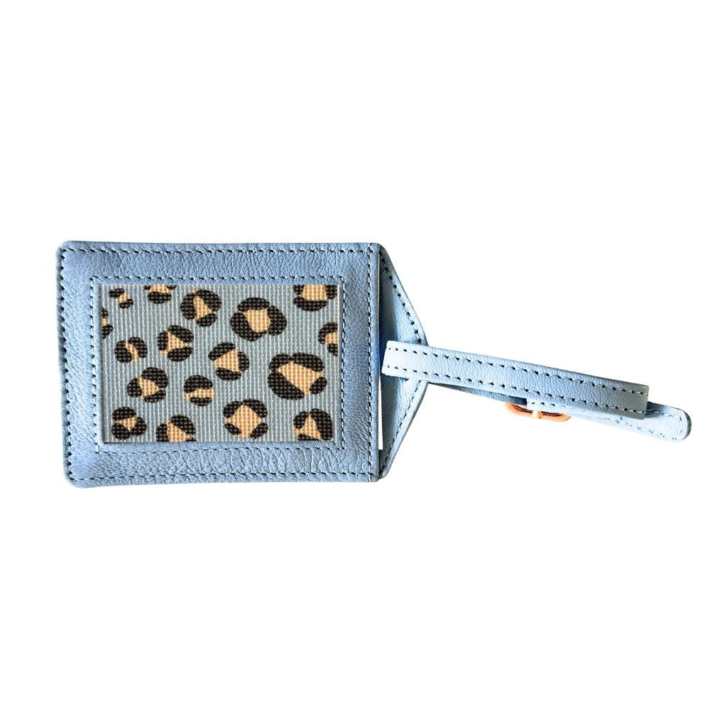 needlepoint Luggage tag with leopard print design on a light blue background