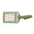 Green luggage tag with a reflective surface on a white background