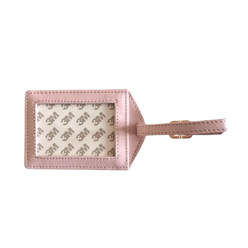 Pink luggage tag with 3M logo on a white background