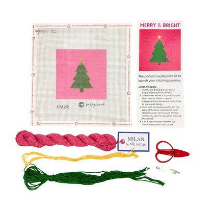 A Christmas tree needlepoint kit with threads and scissors