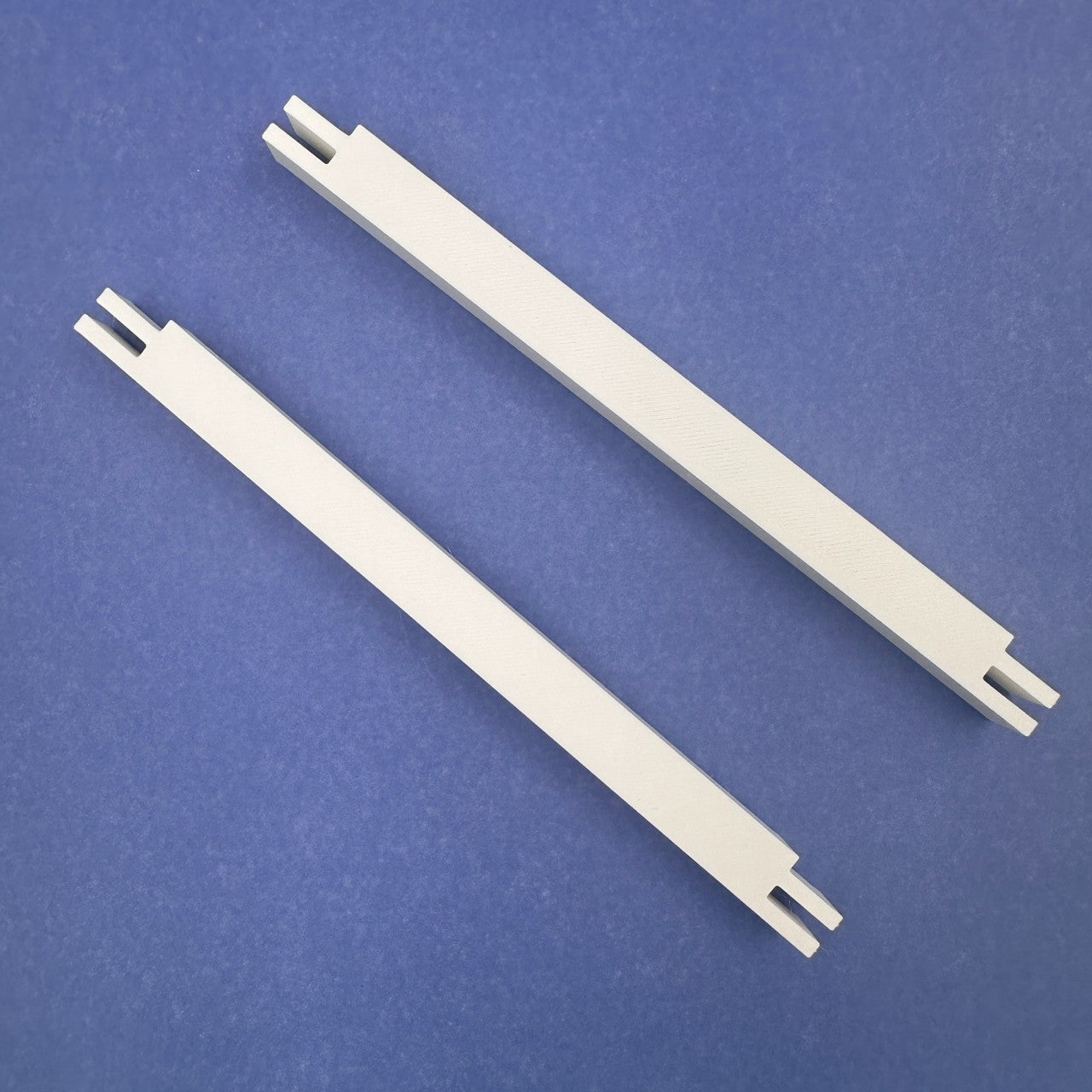 a pair of plastic smini tretcher bars