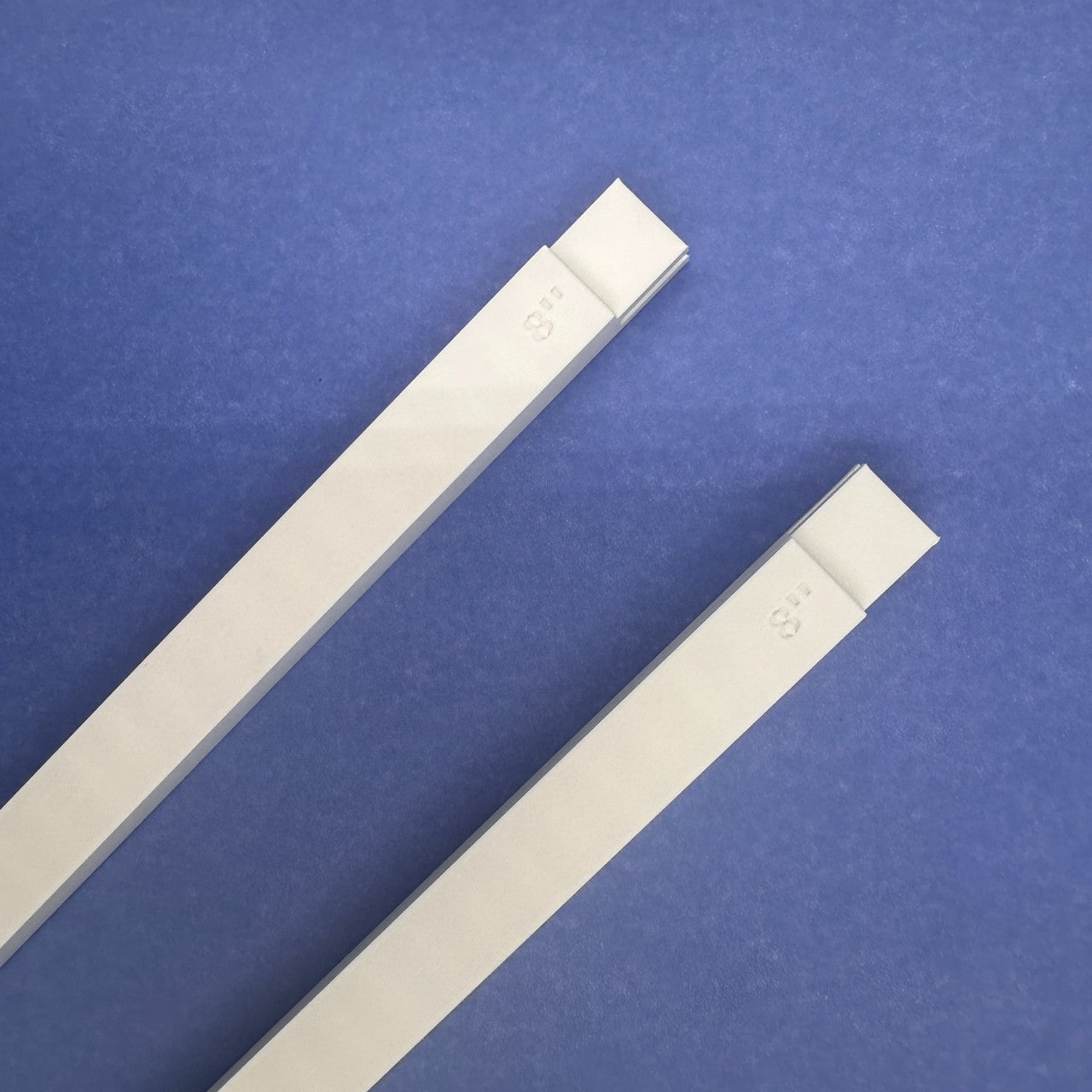 Two white 8 inch plastic mini stretcher bars