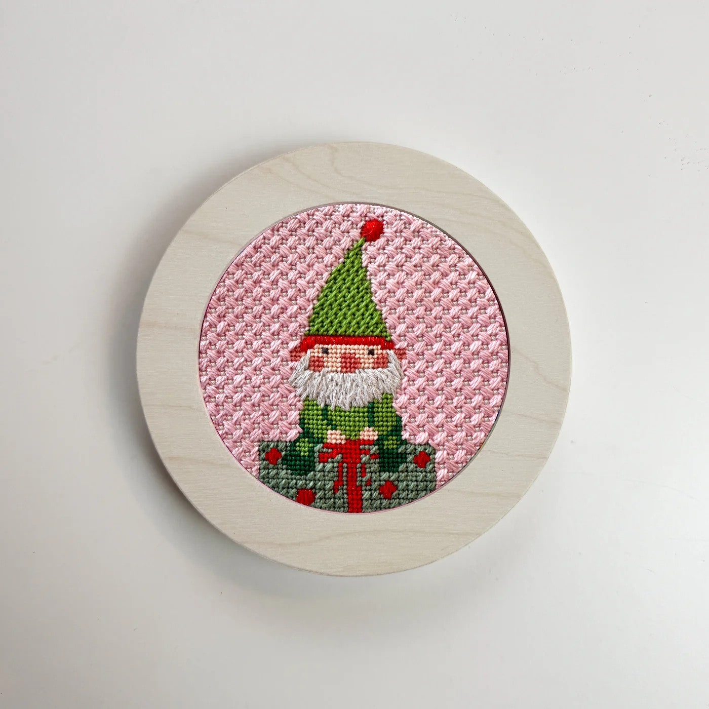 elf needlepoint in white round frame