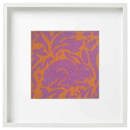 Morris rabbit needlepoint in pink and orange in a frame
