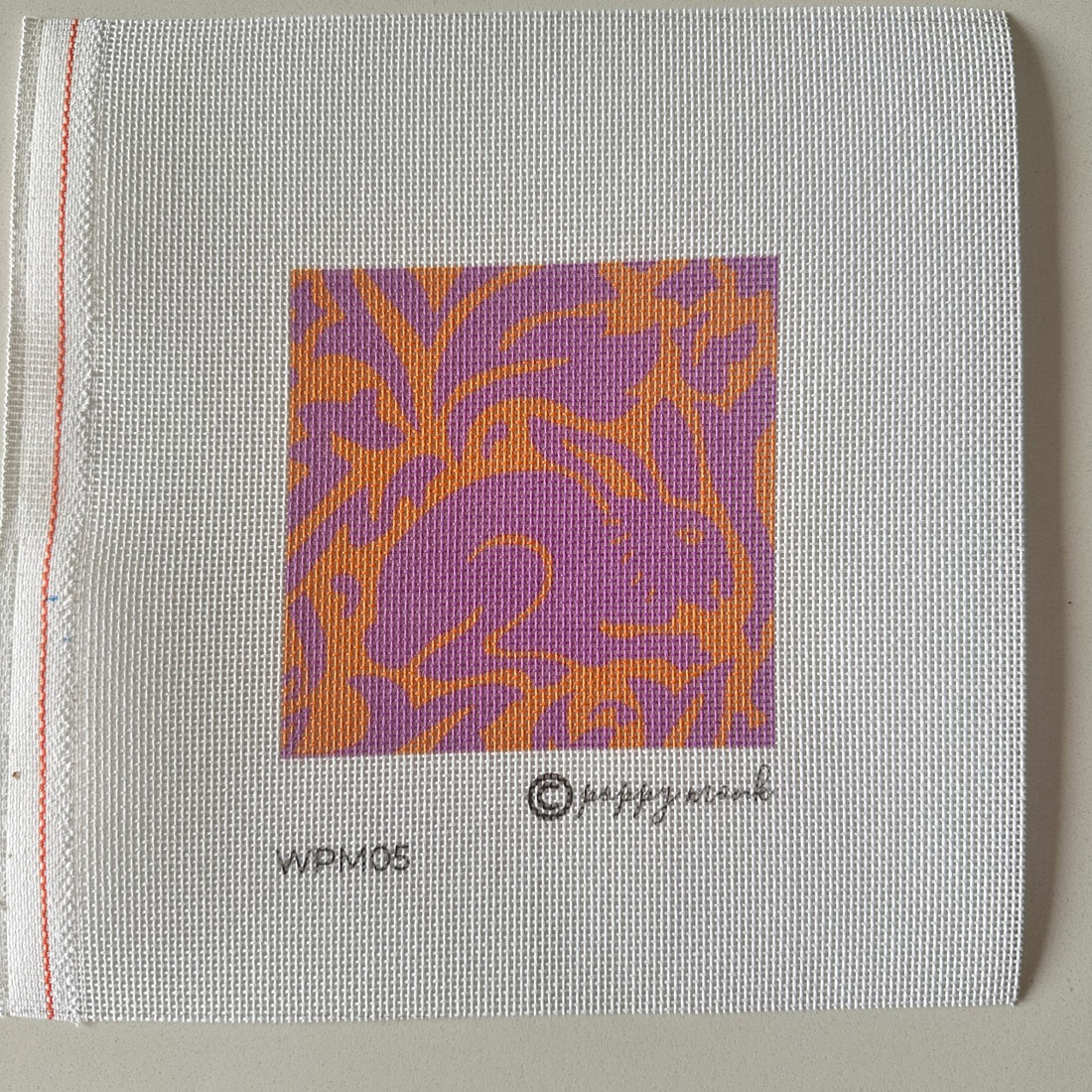 rabbit needlepoint design in pink and orange