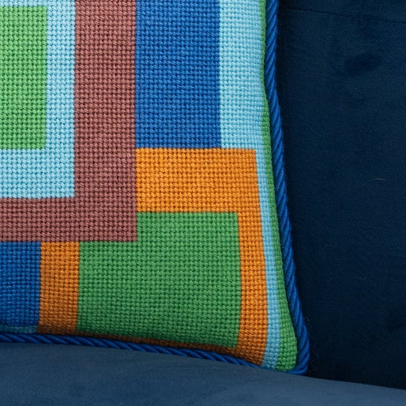 close up of a needlepoint pillow