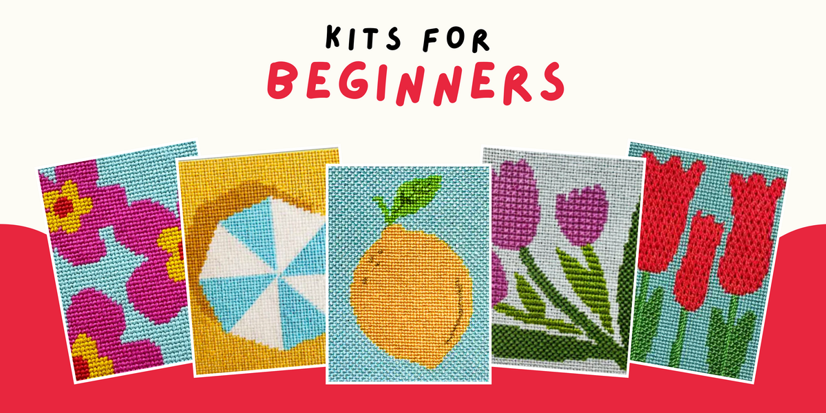 Five needlepoint kits with colorful designs on a red background, labeled 'Kits for Beginners'.