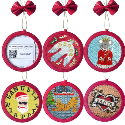 needlepoint ornaments shown in self-finishing leather holders
