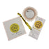 A needlepoint kit with modern floral motif and a scalloped frame