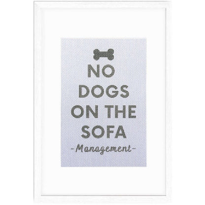 No Dogs On The Sofa sign in a frame