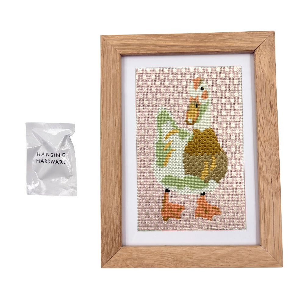 Framed needlepoint duck in a premium oak frame