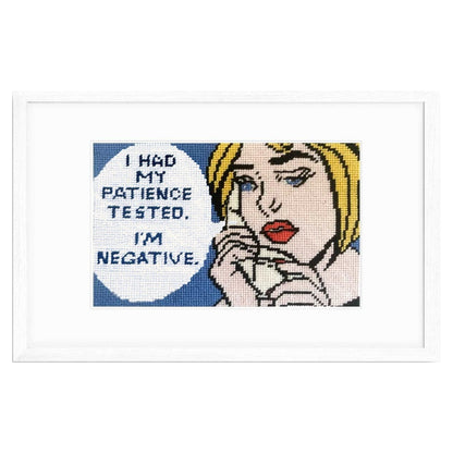 Needlepoint design in a white frame