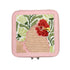 Small pink case with a needlepoint hen design on a white background