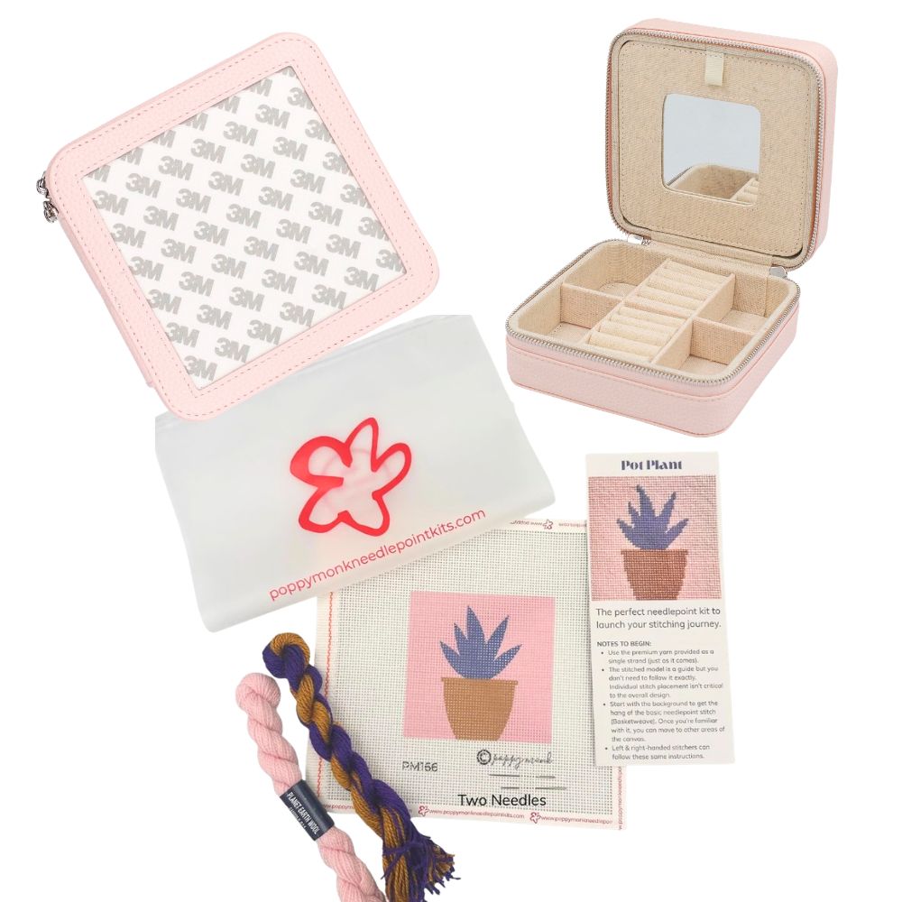 A product bundle for a knitting or needlework kit, featuring a pink zippered case with a mirror, a white drawstring pouch with a red flower logo, a braided pink and purple cord, a printed instruction sheet, and a card labeled &