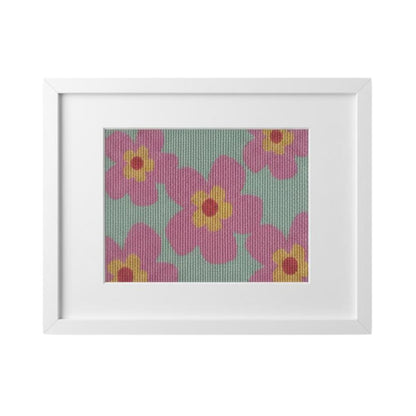 Colorful needlepoint canvas of pink flowers in a frame