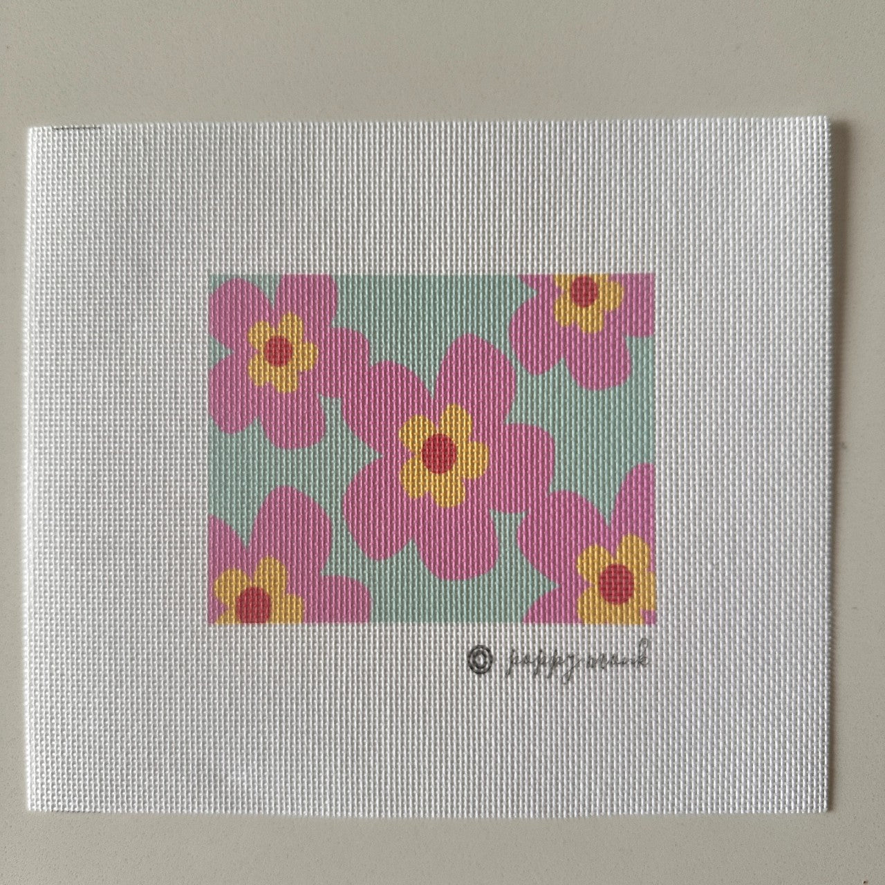 Needlepoint canvas of pink flowers
