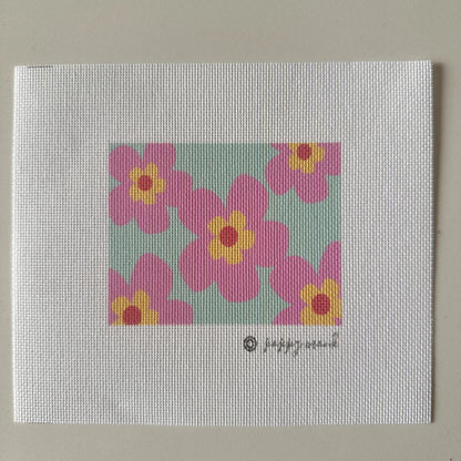Needlepoint canvas of pink flowers