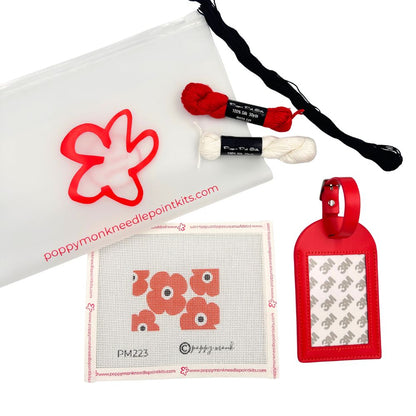 Needlepoint kit with red luggage tag and poppies design