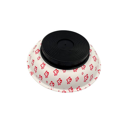 An upside view of a white ish with a magnet base