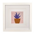 Framed needlepoint artwork of a potted plant on a white background