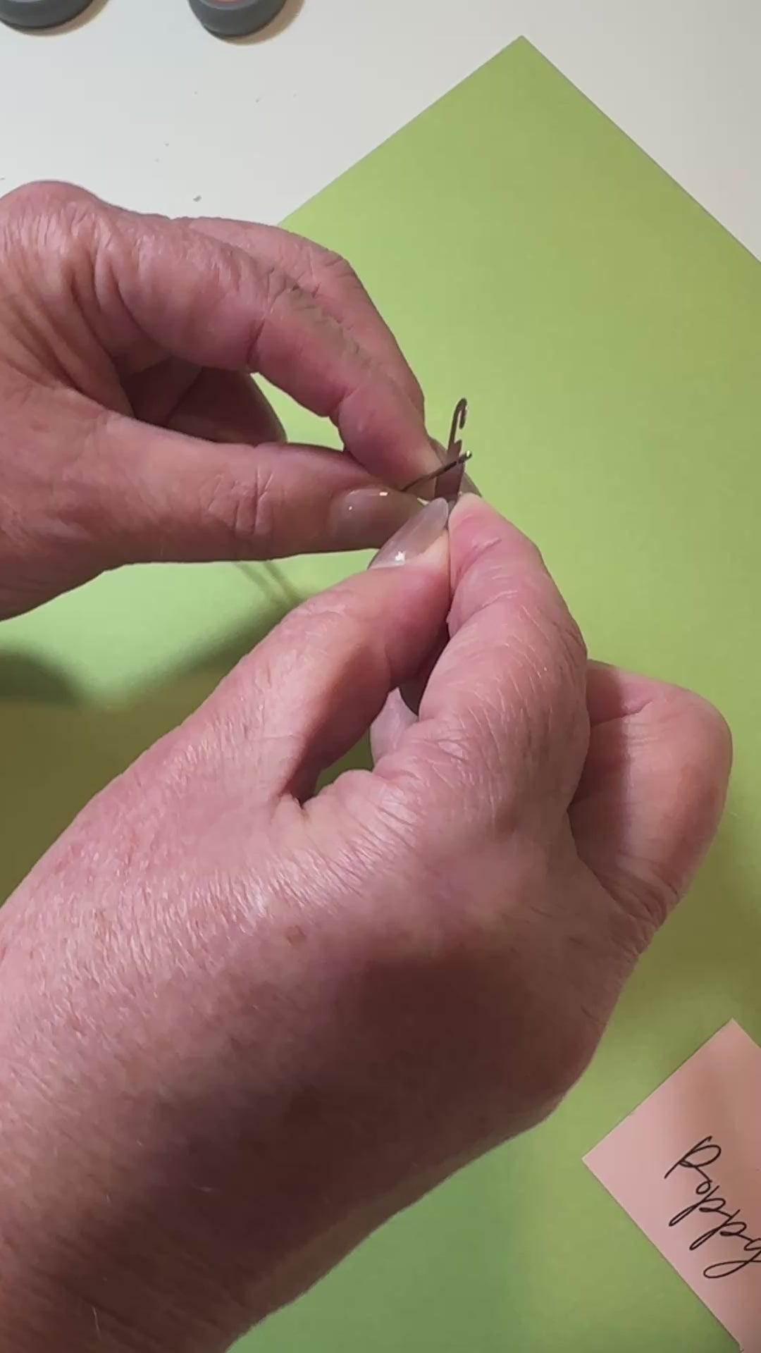 showing how to use a needle threader