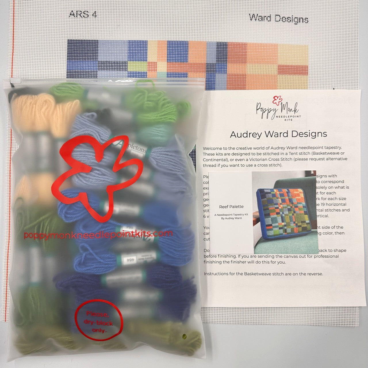 Needlepoint kit with yarn and tools, featuring Audrey Ward Designs branding.