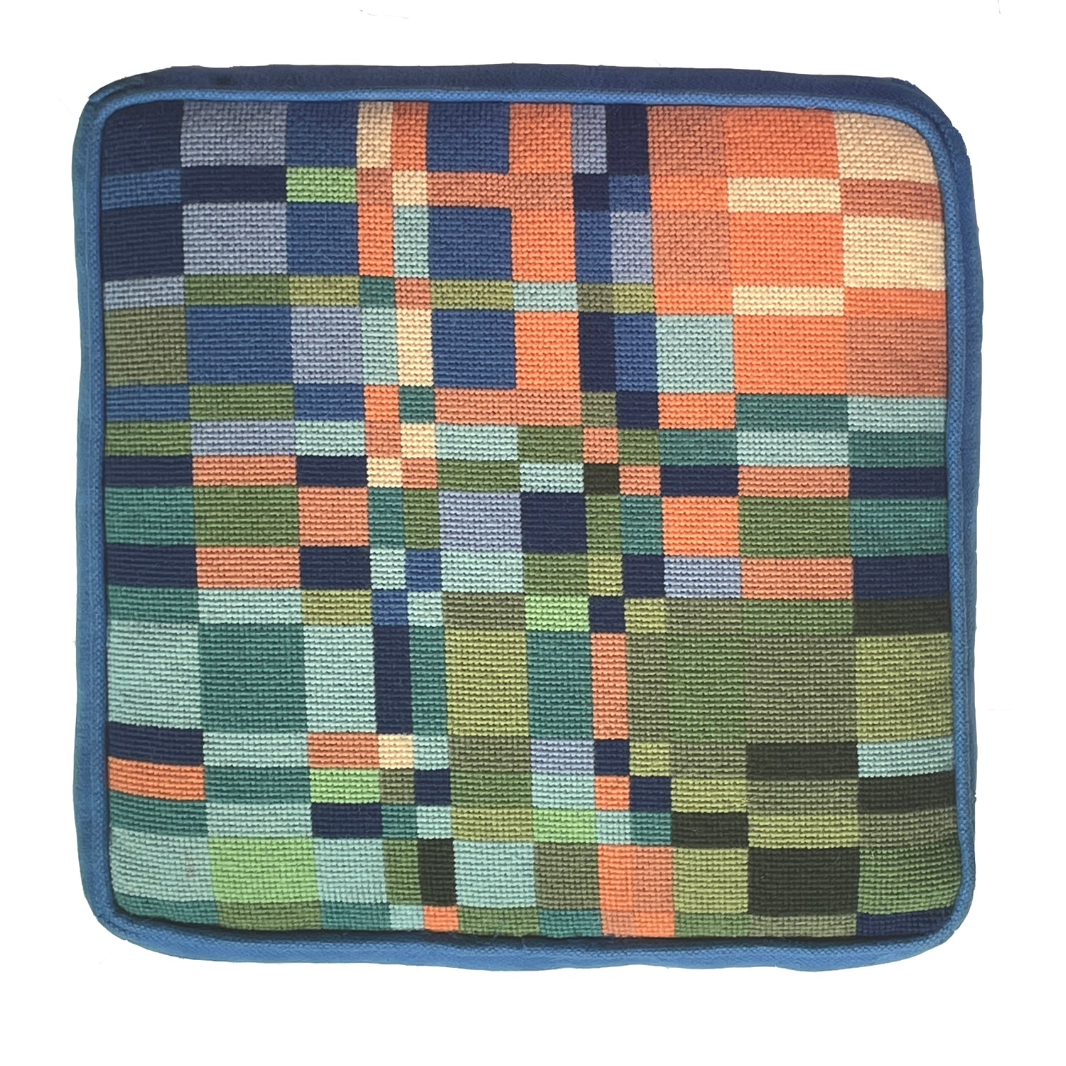 Square patchwork cushion with a geometric pattern on a white background