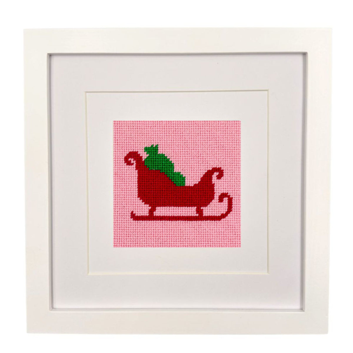 A framed needlepoint design of Santa&