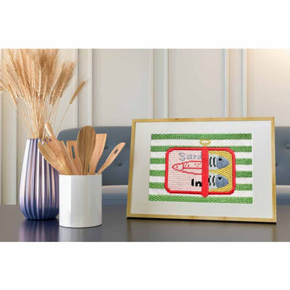 Sardines needlepoint in a frame