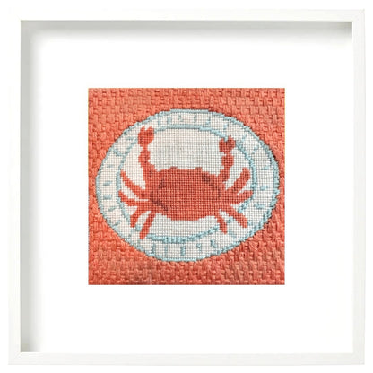 Framed needlepoint design of a crab on a plate