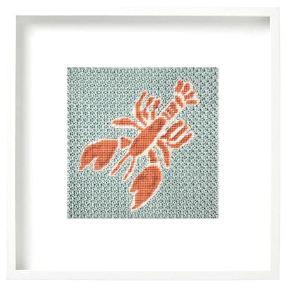 Lobster needlepoint design in a white frame